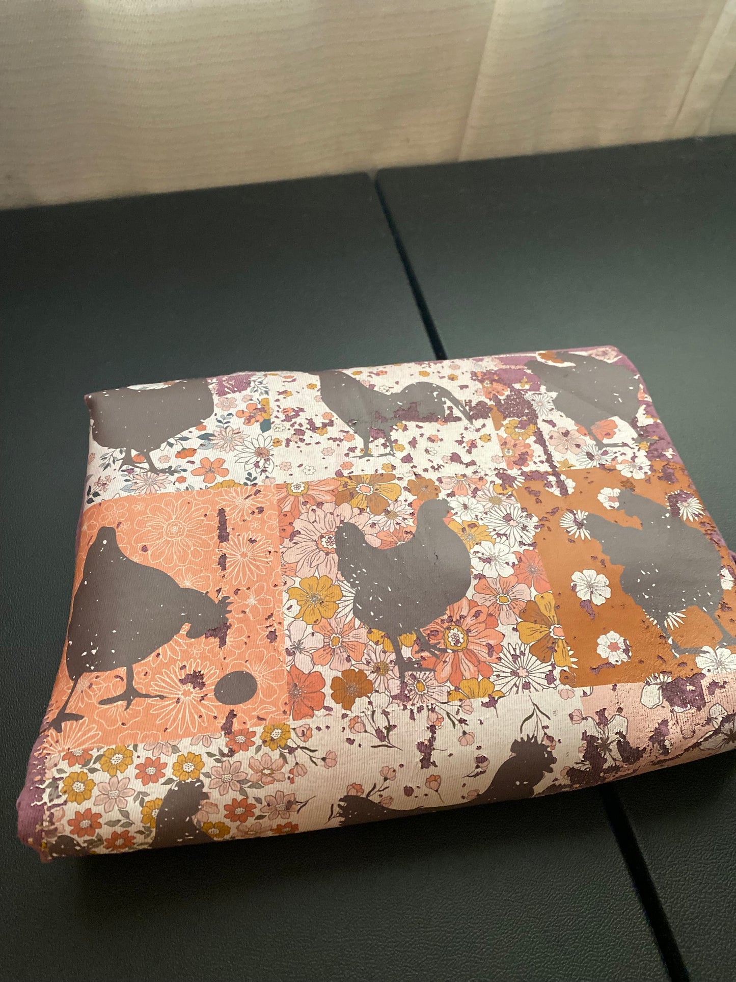 graphic transfer with floral and animal pattern on a berry color t-shirt