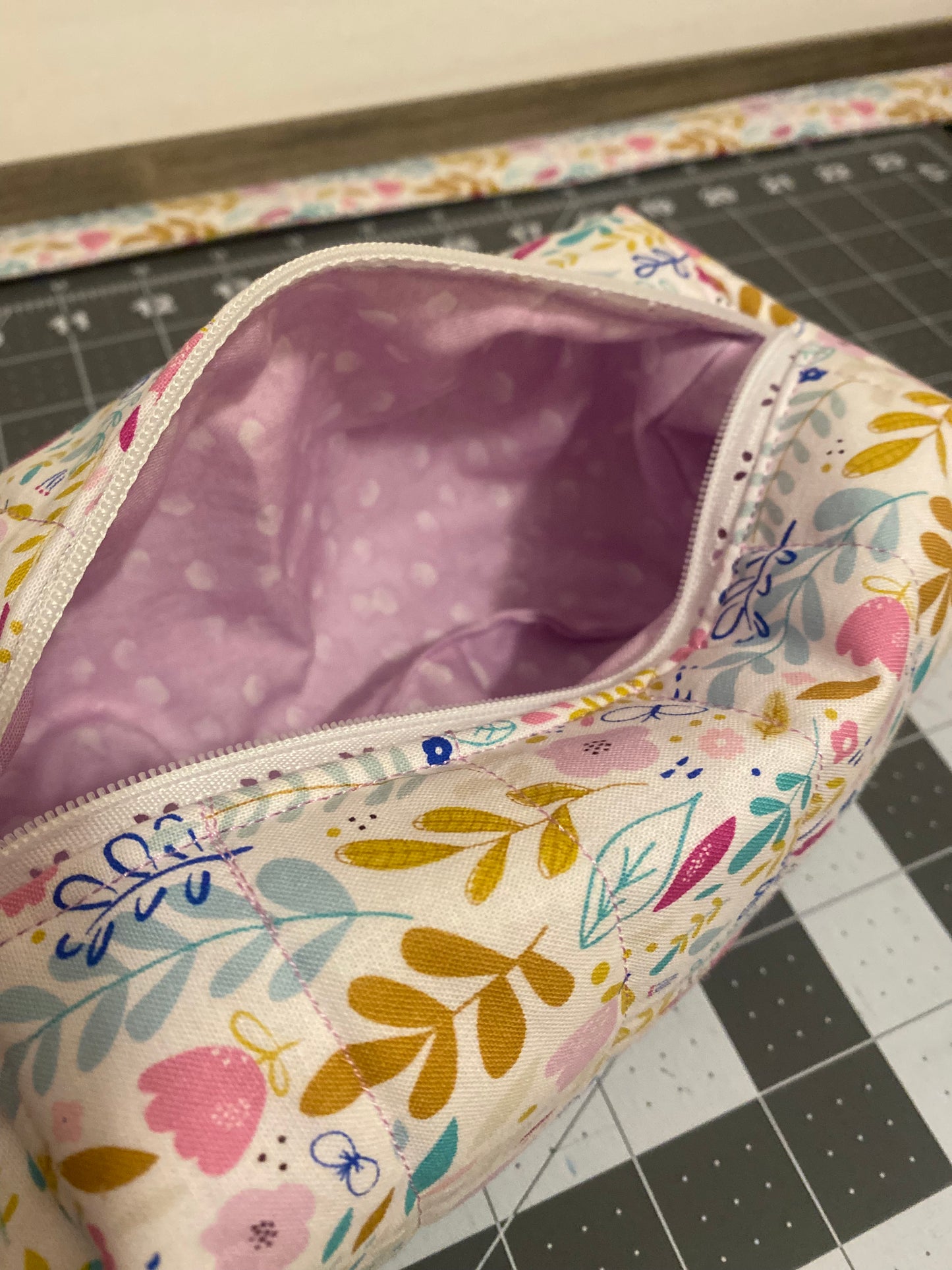 Floral-patterned fabric on a cutting mat